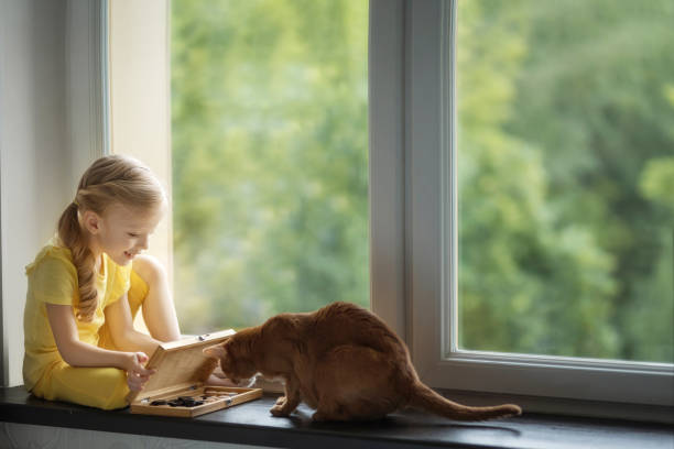 istock girl and checkers with a cat 1366833492