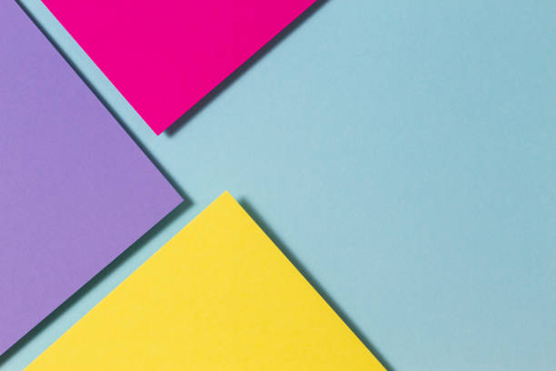 istock Abstract color papers geometry flat lay composition banner background with purple, yellow, magenta and blue color tones 1366833540