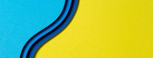 Abstract color papers geometry flat lay composition background with blue and yellow tones