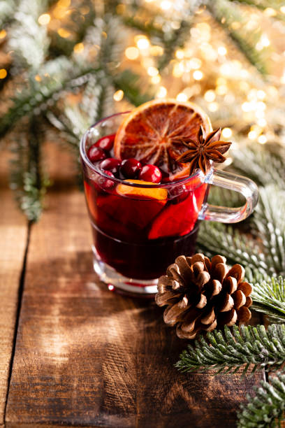 istock Christmas mulled wine with spices on a wooden rustic table. 1366834785