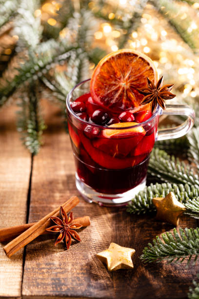 istock Christmas mulled wine with spices on a wooden rustic table. 1366835641