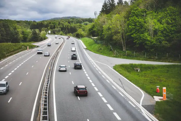 Photo of High point of view on A40 motorway with traffic in the French countryside of Ain department