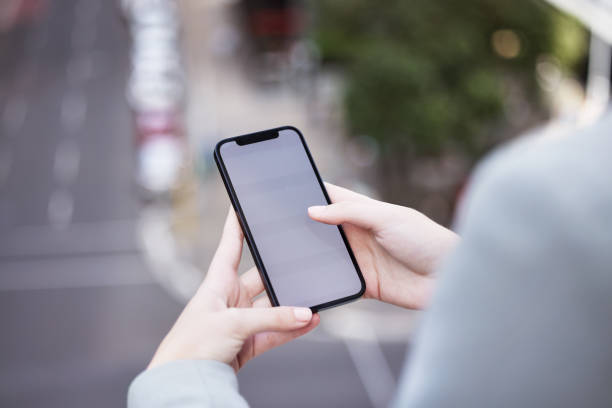 istock Cropped shot of an unrecognizable businessman using his cellphone outside 1366837632