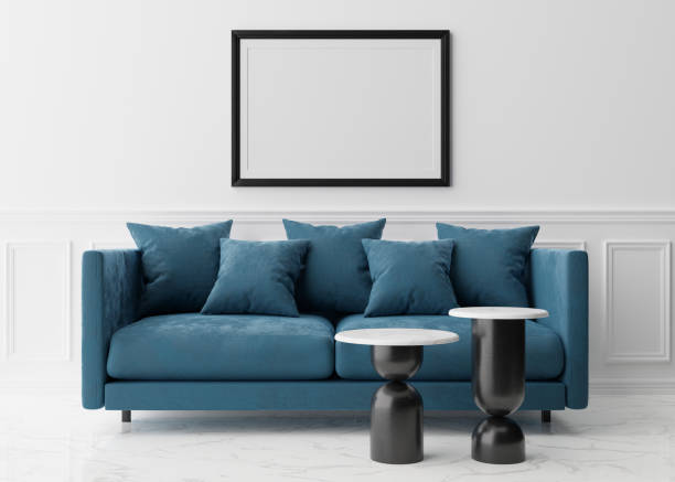 istock Empty black picture frame on white wall in modern living room. Mock up interior in classic style. Free space, copy space for your picture. Blue sofa. 3D rendering. 1366841987