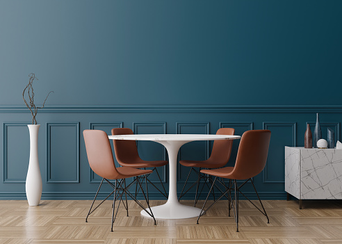 Empty blue wall in modern dining room. Mock up interior in classic style. Free space, copy space for your picture, text, or another design. Dinig table with brown chairs, parquet floor. 3D rendering