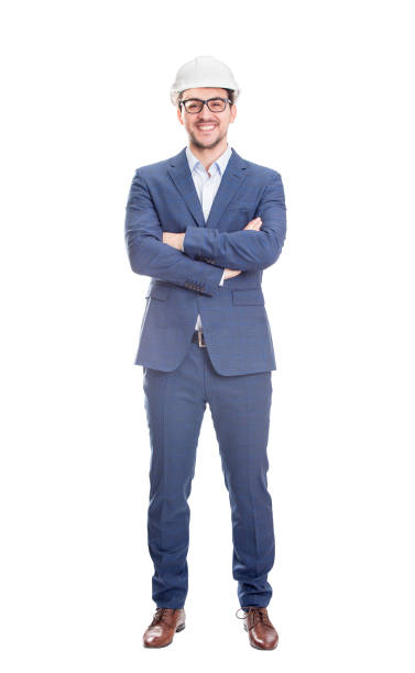 cheerful and confident businessman engineer, keeps arms crossed wearing protective hardhat smiles looking to camera isolated over white background. - businessman business arms crossed business person imagens e fotografias de stock