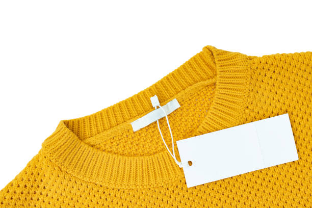 istock White blank rectangular clothing tag on yellow knitted sweater isolated on white background 1366844658