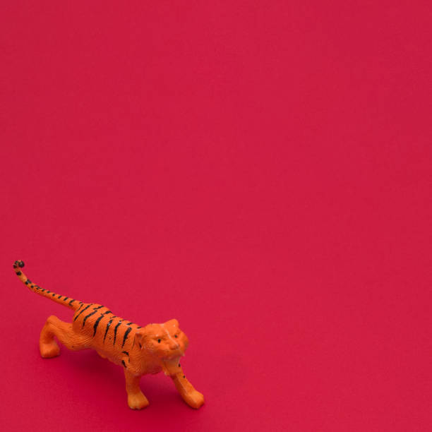 istock Tiger on a red background wallpaper with copy space. Minimai scene. 1366845717