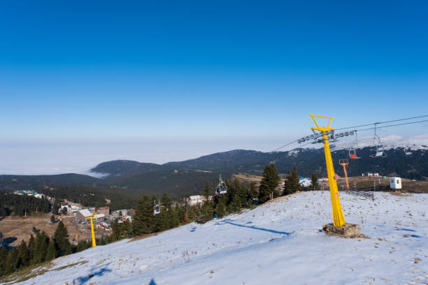 istock ski lift gondolas moving over snowy mountain in winter 1366846700