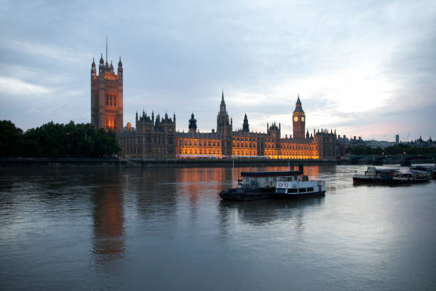 istock River Thames boats and Parliament at dusk 1366848171