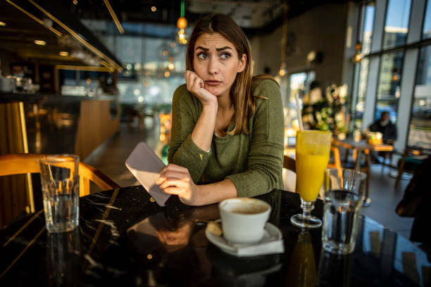 istock Worried woman at Cafe 1366848306