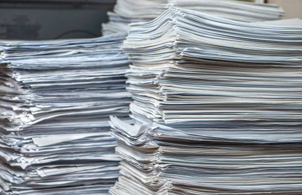 pile of paper documents in the office, paper trash, waste paper stock photo