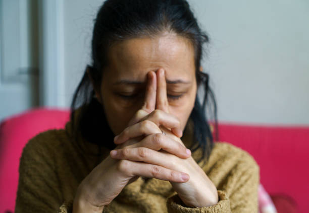 istock Tired Young Woman Leaning Head on Hands 1366850335