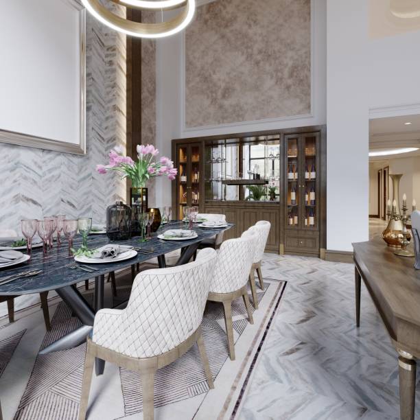 istock Designer dining table in a luxurious interior with high ceilings and a cupboard for crystal glassware and wine. 1366851612