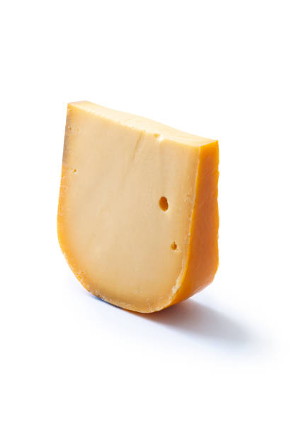 un pezzo di formaggio gouda olandese. - cheese isolated portion dutch culture foto e immagini stock