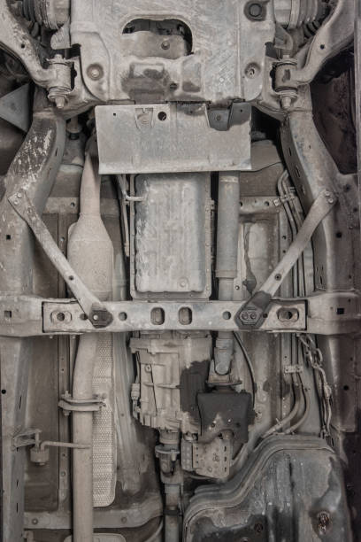 istock Underneath a motor vehicle onn a ramp in a workshop. 1366853431