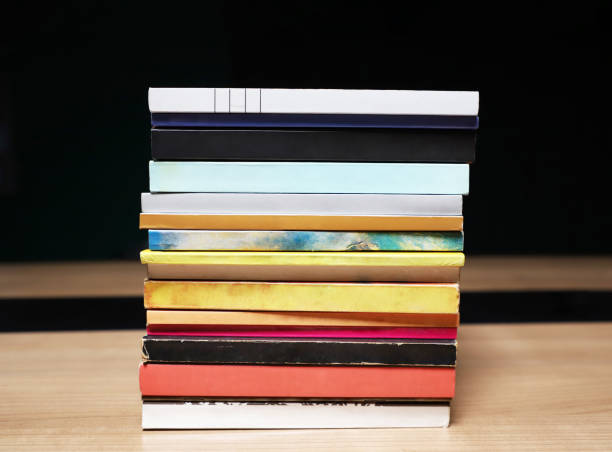 istock book stack view from the spine of the book. old books pile 1366853491