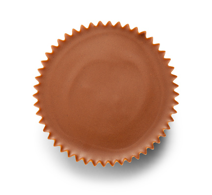 Single Chocolate Peanut Butter Cup Cut Out on White.