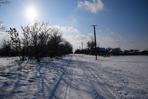 Winter in the village, Snow-covered street in the Russian Cossack village.