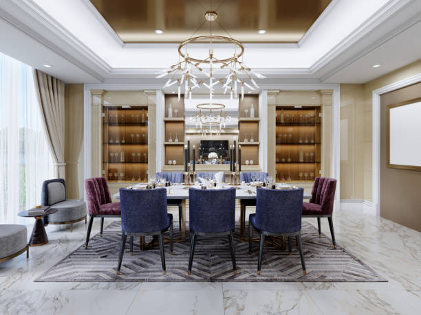 istock Luxurious dining area in a modern interior with a white table and burgundy and blue upholstered chairs near the shelves with glassware for serving. 1366855552
