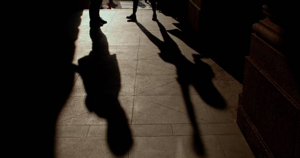 istock Move their arms and legs. Creative on a walk. A game of shadows. 1366856016