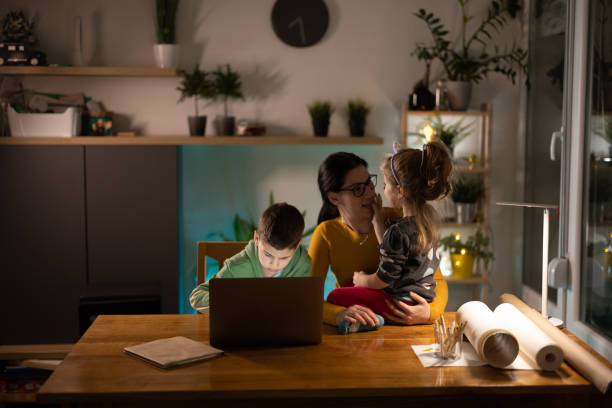 istock Mom with children at home 1366856536