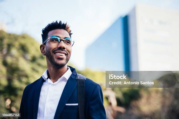 Portrait Of Dreamy Young Black Man Looking At Infinity In A Park Stock Photo - Download Image Now