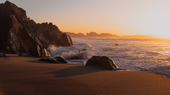 A view of a sunset on a beach in Big Sur, Ca.