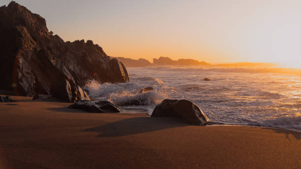 Big Sur Sunset A view of a sunset on a beach in Big Sur, Ca. big sur stock pictures, royalty-free photos & images