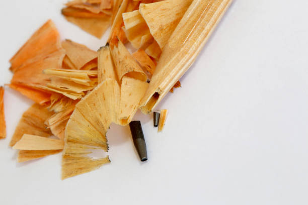 Stationery, metal pencil sharpener on a wood table composition