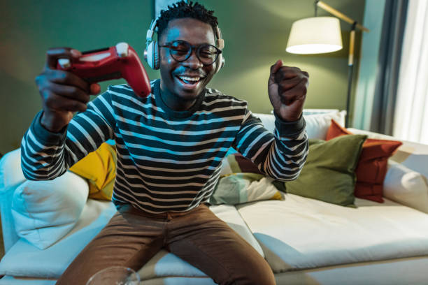 istock Online playing video games and winning 1366866998