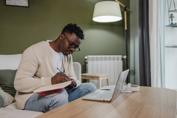 istock Young African American man attends an online course 1366867053