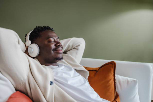 istock Young African-American man relaxing at home 1366867328