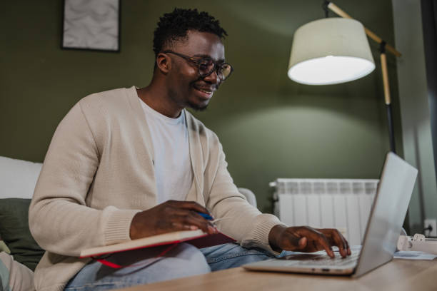 istock Young African American man attends an online course 1366867389