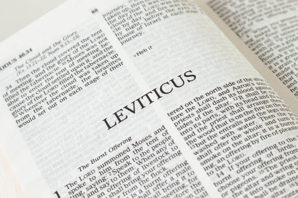 istock Leviticus open Holy Bible Book close-up. 1366867544