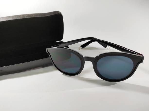 istock Sunglasses and black box on a white background 1366869205