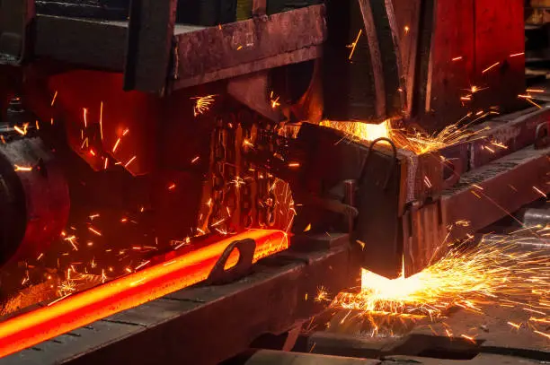 The process of cutting hot rolled steel into lengths.