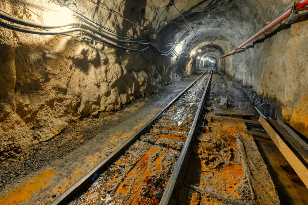 istock Underground mine. Underground railway for transporting ore. Mine trolley as part of an underground freight train 1366870175