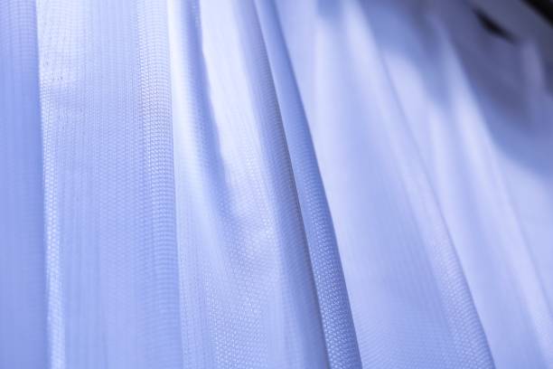 istock A simple bluish lace curtain by the window 1366872115