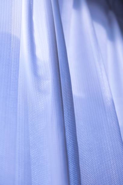 istock A simple bluish lace curtain by the window 1366872117