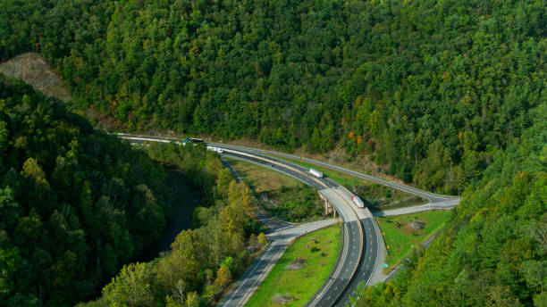 istock Drone Shot of Interstate Traffic in the Appalachian Mountains 1366880678
