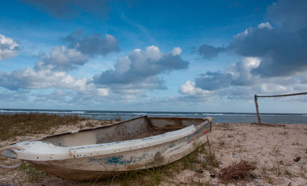 an abandoned boat on the shore
