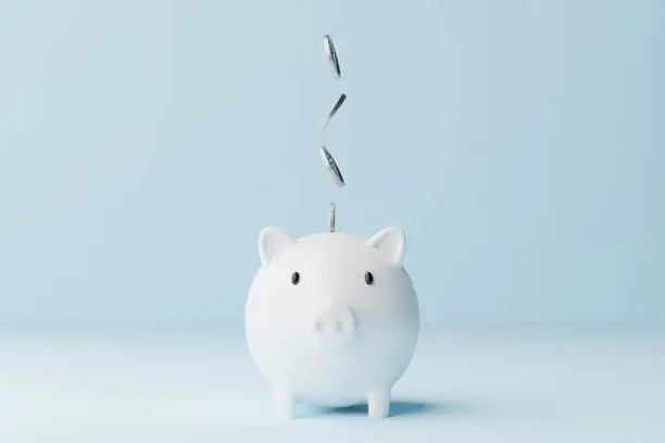 Photo of Save money and investment concept. Piggy bank and silver coins falling. 3d rendering illustration