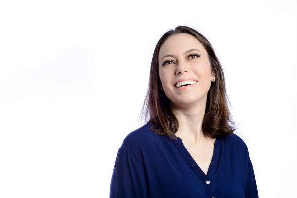 istock Beautiful woman smiling looking up 1366888136