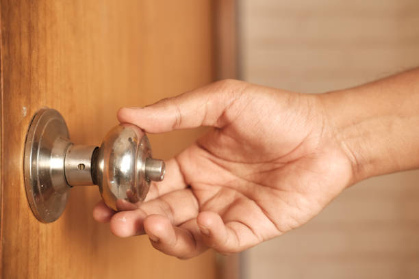istock Man's Hand Opening door close up 1366888424