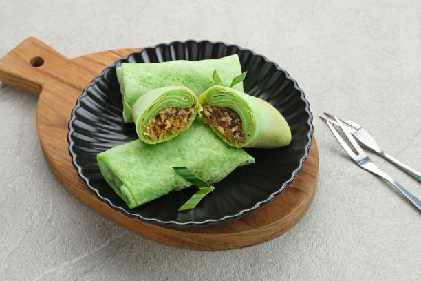 Kue dadar gulung (Sweet coconut pancake), Indonesian dessert made from flour with grated coconut mixed palm sugar.