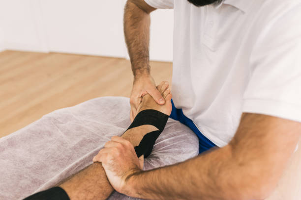 istock Close-up view of a professional therapist treating a patient foot. 1366891663