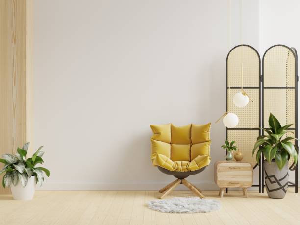 istock Modern living room interior with yellow armchair on empty white wall. 1366892415