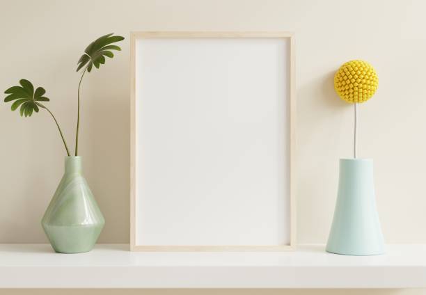 istock Vertical wooden frame mockup with green plants on white wall background. 1366892471