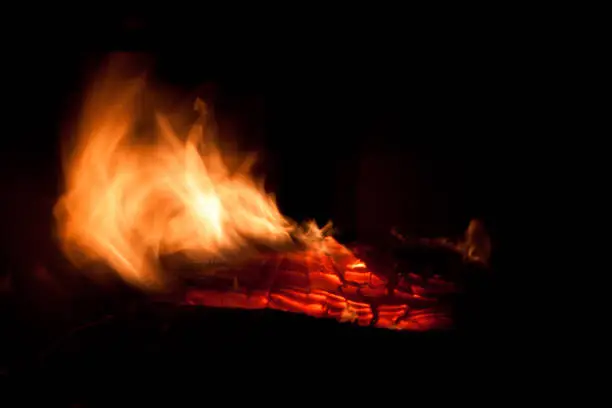 orange flames of fire burning in woodstove